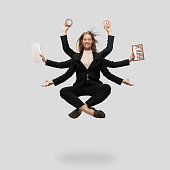 Beautiful business woman, secretary, multi-armed manager levitating isolated on grey studio background