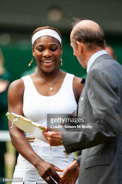 Serena Williams of the USA receives the runner up trophy from Prince Edward, Duke of Kent after loosing to Maria Sharapova of Russia at The Wimbledon...