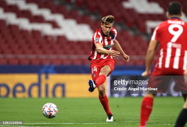 Marcos Llorente of Atletico de Madrid scores his team's first goal during the UEFA Champions League Group A stage match between Atletico Madrid and...
