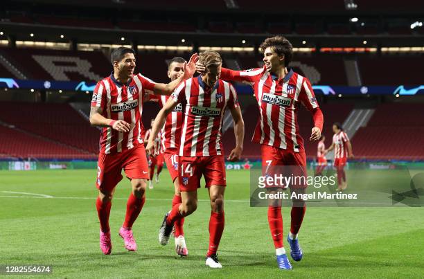 Marcos Llorente of Atletico de Madrid celebrates after he scores his team's first goal during the UEFA Champions League Group A stage match between...