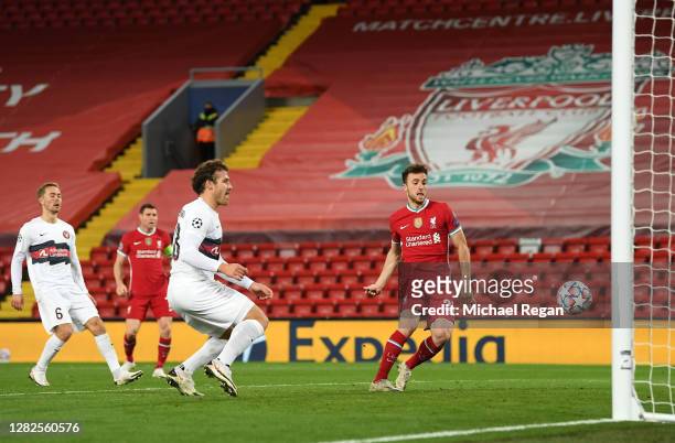 Diogo Jota of Liverpool scores his team's first goal during the UEFA Champions League Group D stage match between Liverpool FC and FC Midtjylland at...