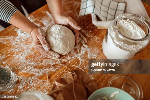 woman's hands kneading sourdough - baking bread stock pictures, royalty-free photos & images