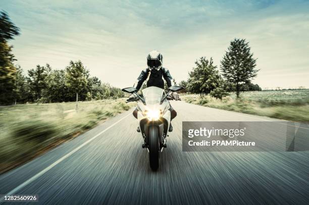 motorcycle in blurred motion - front view stock pictures, royalty-free photos & images