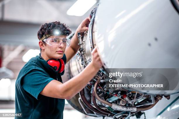aircraft mechanic inspects the jet engine - aircraft maintenance stock pictures, royalty-free photos & images