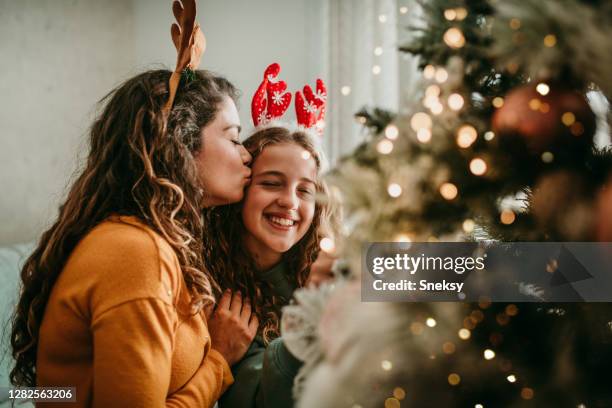 marry christmas, my child! - people kissing stock pictures, royalty-free photos & images