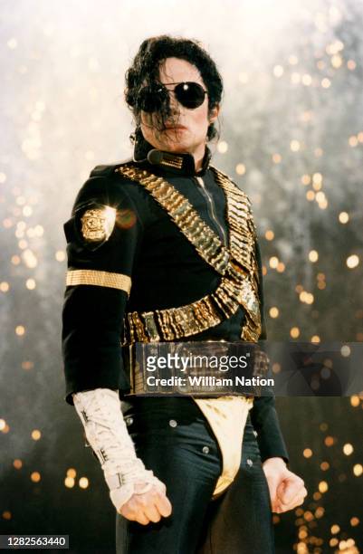 American singer, songwriter, and dancer Michael Jackson performs on stage during a concert for the 50th birthday of Hassanal Bolkiah, the Sultan of...