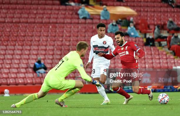 Mohamed Salah of Liverpool is fouled by Paulinho of FC Midtjylland which leads to a penalty being awarded during the UEFA Champions League Group D...