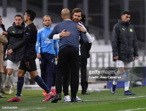 Andre Villas-Boas, Head Coach of Marseille and Pep Guardiola, Manager of Manchester City embrace after the UEFA Champions League Group C stage match...