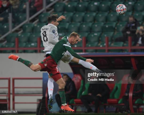 Javi Martinez of FC Bayern Muenchen competes for the ball with Vladislav Ignatyev of Lokomotiv Moskva during the UEFA Champions League Group A stage...