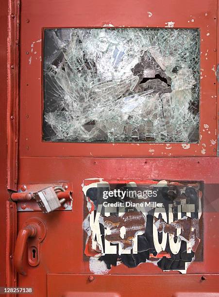 keep out sign on red door with shattered window - keep out sign imagens e fotografias de stock