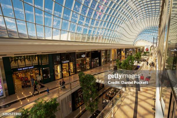 People are seen shopping at Chadstone Shopping Centre on October 28, 2020 in Melbourne, Australia. Lockdown restrictions in Melbourne lifted as of...