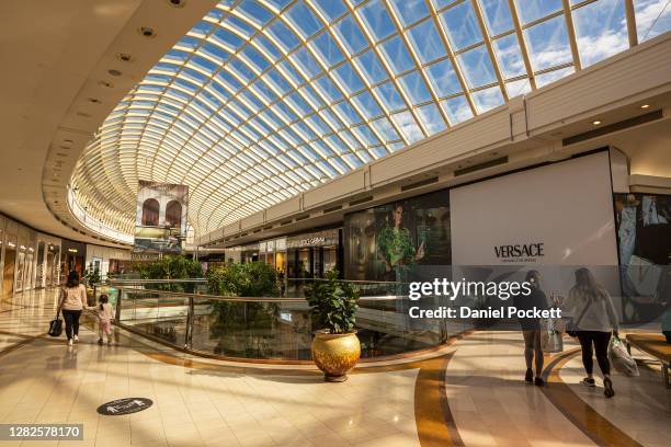 People are seen shopping at Chadstone Shopping Centre on October 28, 2020 in Melbourne, Australia. Lockdown restrictions in Melbourne lifted as of...