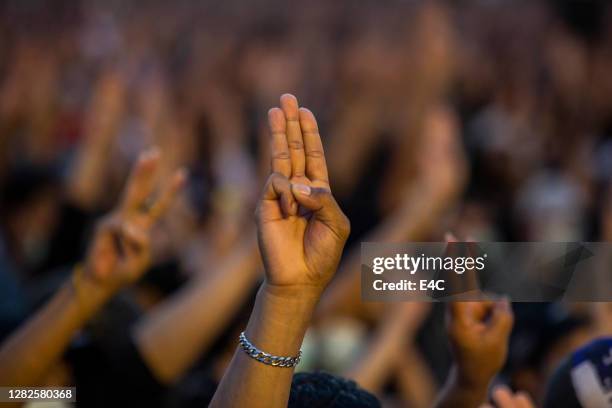 anti-government protests in bangkok - asian protestor stock pictures, royalty-free photos & images