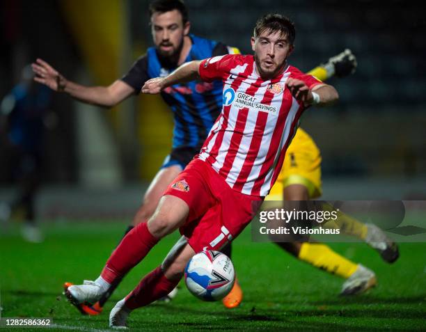 Lyndon Gooch of Sunderland and Eoghan O'Connell in action during the Sky Bet League One match between Rochdale and Sunderland at Crown Oil Arena on...