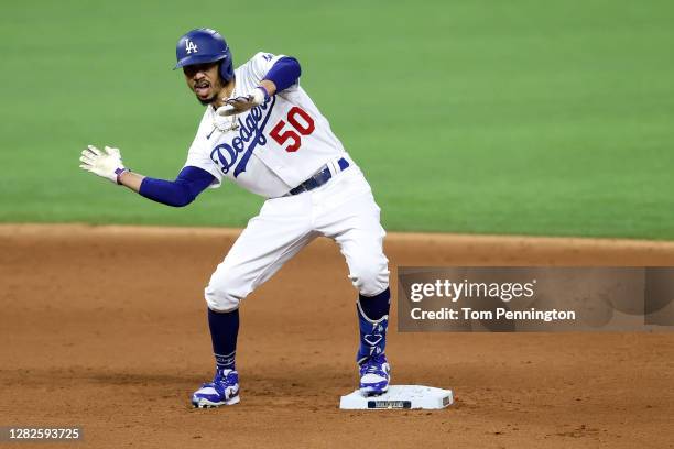 Mookie Betts of the Los Angeles Dodgers celebrates after hitting a double against the Tampa Bay Rays during the sixth inning in Game Six of the 2020...