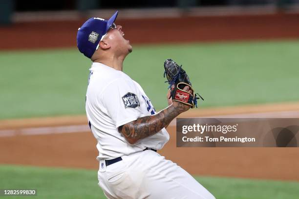 Julio Urias of the Los Angeles Dodgers celebrates after defeating the Tampa Bay Rays 3-1 in Game Six to win the 2020 MLB World Series at Globe Life...