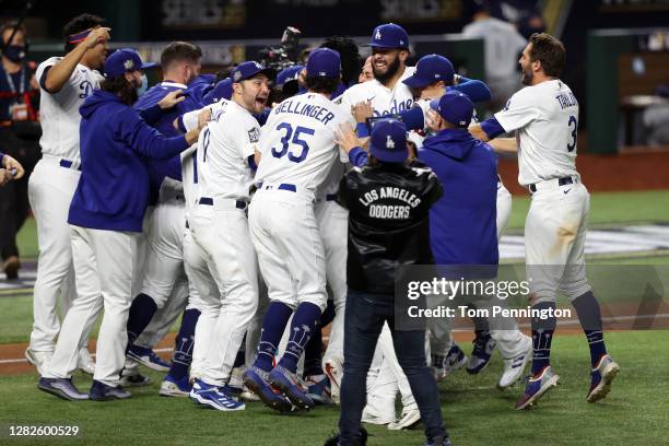 The Los Angeles Dodgers celebrate after defeating the Tampa Bay Rays 3-1 in Game Six to win the 2020 MLB World Series at Globe Life Field on October...