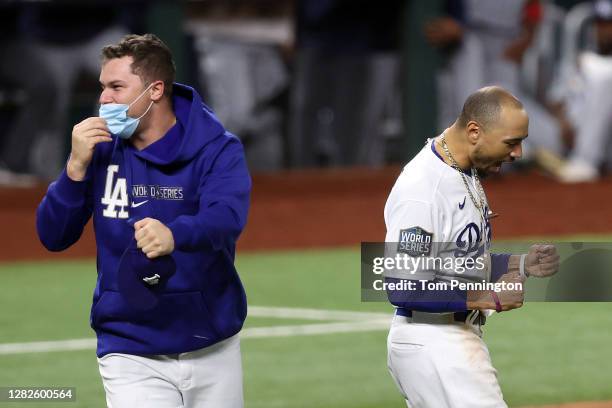 Joc Pederson and Mookie Betts of the Los Angeles Dodgers celebrate after defeating the Tampa Bay Rays 3-1 in Game Six to win the 2020 MLB World...