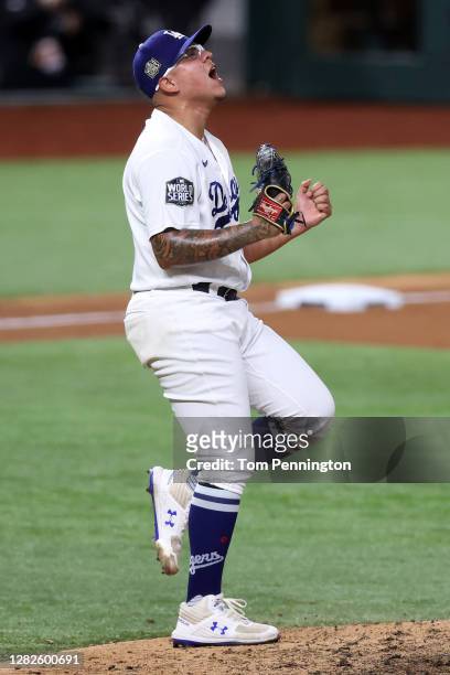 Julio Urias of the Los Angeles Dodgers celebrates after defeating the Tampa Bay Rays 3-1 in Game Six to win the 2020 MLB World Series at Globe Life...