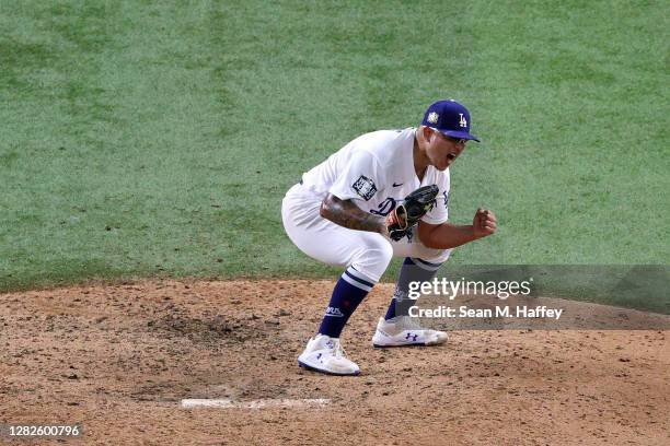 Julio Urias of the Los Angeles Dodgers celebrates after defeating the Tampa Bay Rays 3-1 in Game Six to win the 2020 MLB World Series at Globe Life...