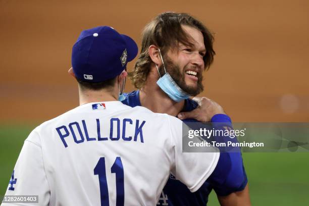 Pollock and Clayton Kershaw of the Los Angeles Dodgers celebrate after defeating the Tampa Bay Rays 3-1 in Game Six to win the 2020 MLB World Series...
