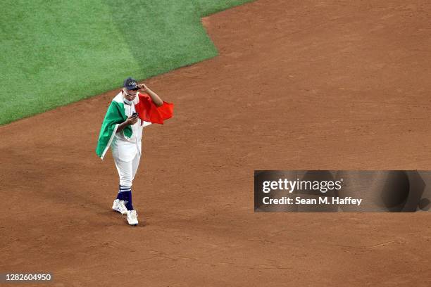 Julio Urías of the Los Angeles Dodgers celebrates on the field after defeating the Tampa Bay Rays 3-1 in Game Six to win the 2020 MLB World Series at...