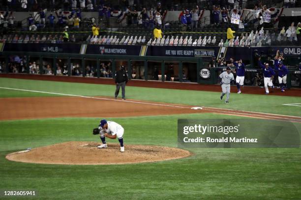 Julio Urias of the Los Angeles Dodgers celebrates after defeating the Tampa Bay Rays 3-1 in Game Six to win the 2020 MLB World Series at Globe Life...