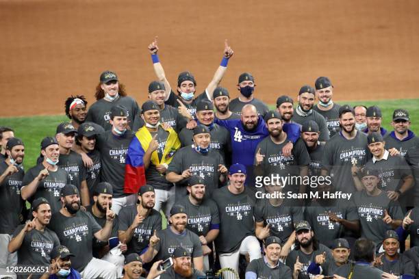 The Los Angeles Dodgers pose for a photo after defeating the Tampa Bay Rays 3-1 in Game Six to win the 2020 MLB World Series at Globe Life Field on...