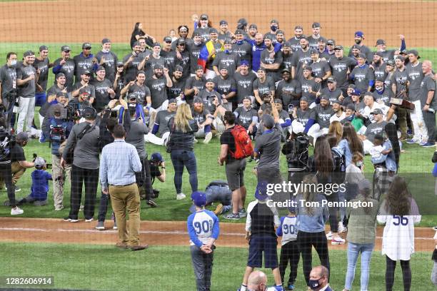 The Los Angeles Dodgers pose for a photo after defeating the Tampa Bay Rays 3-1 in Game Six to win the 2020 MLB World Series at Globe Life Field on...