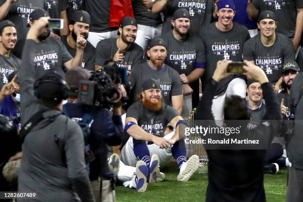 Justin Turner and the Los Angeles Dodgers pose for a photo after defeating the Tampa Bay Rays 3-1 in Game Six to win the 2020 MLB World Series at...