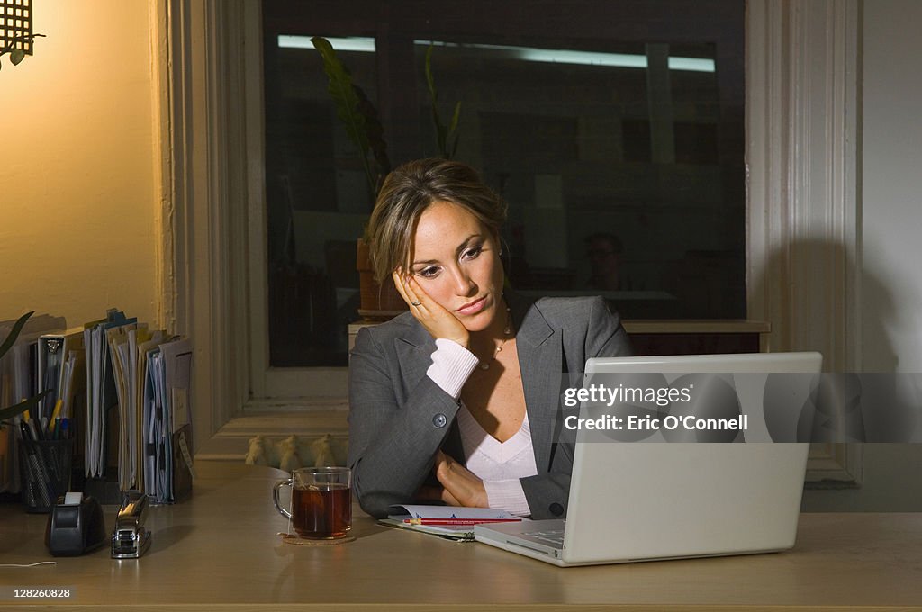 Businesswoman working late night in office