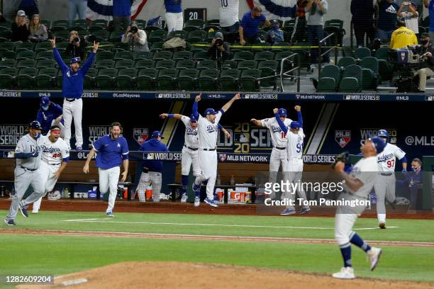 The Los Angeles Dodgers celebrate after Julio Urias strikes out Willy Adames , of the Tampa Bay Rays to give the Dodgers the 3-1 victory in Game Six...