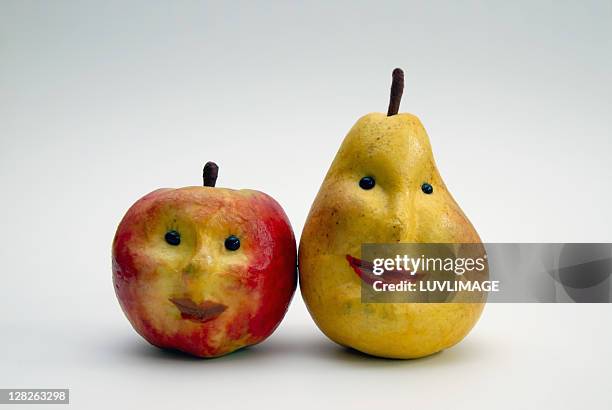 paper apple and pear with faces - papier stock pictures, royalty-free photos & images