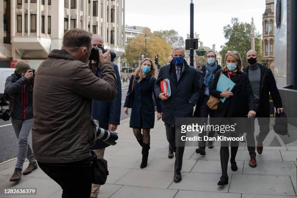 Brexit negotiator Michel Barnier walks with members of the EU delegation to the Department for Business, Energy and Industrial strategy in St. James...