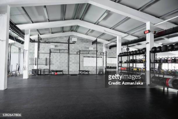 wide angle view of modern open plan gym - health club stock pictures, royalty-free photos & images