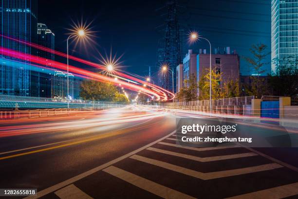 dalian cbd at night - city lights reflected on buildings speed stock pictures, royalty-free photos & images