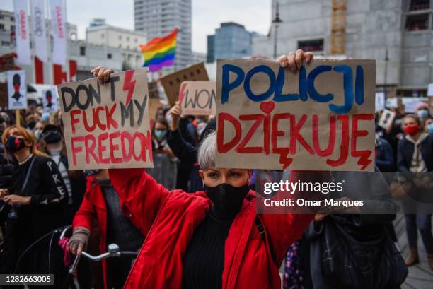 Woman holds a banner as she participates in a national strike for the seventh day of protests against the Constitutional Court ruling on tightening...