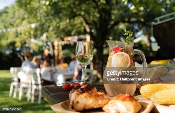 food on table set outdoors for celebrating birthday, garden party concept. - backyard party stock pictures, royalty-free photos & images