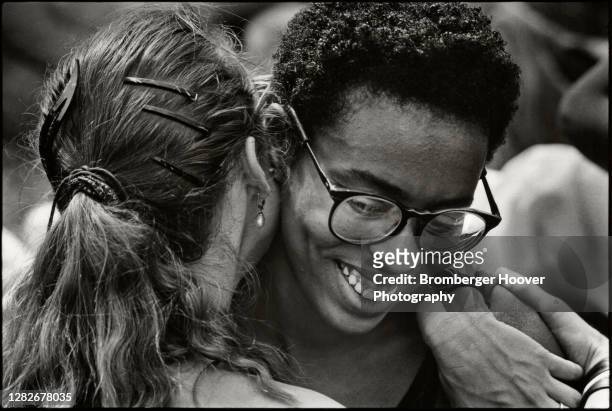 Close-up of a couple as they embrace outside the Civic Center during the International Lesbian & Gay Freedom Day Parade, San Francisco, California,...