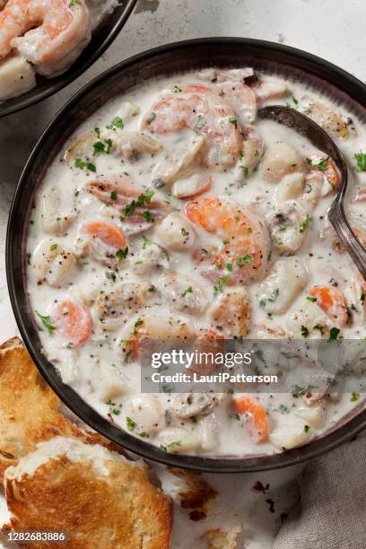 seafood chowder with shrimp, bay scallops, clams and salmon - clam chowder stock pictures, royalty-free photos & images