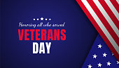 Veterans day greeting card with a blue background and flag. Honoring all who served. - Vector