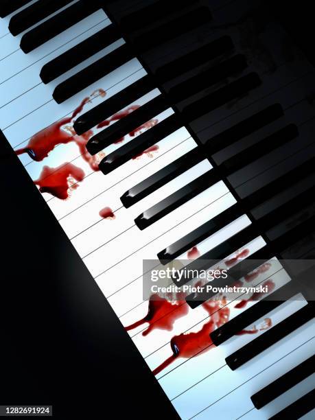 bloody hand prints on piano keyboard. - pianist stock pictures, royalty-free photos & images