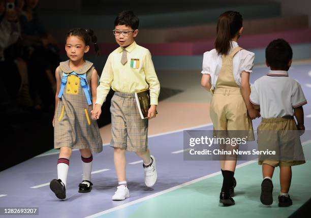 Models showcase designs on the runway during COTTON USA collection show by designer Liu Wei on day 5 of China Fashion Week 2021 Spring/Summer at...