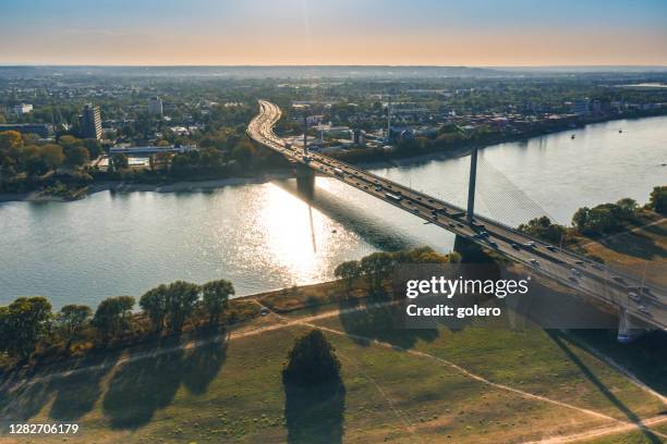 rush hour traffic on modern brige over rhine river - bonn stock pictures, royalty-free photos & images