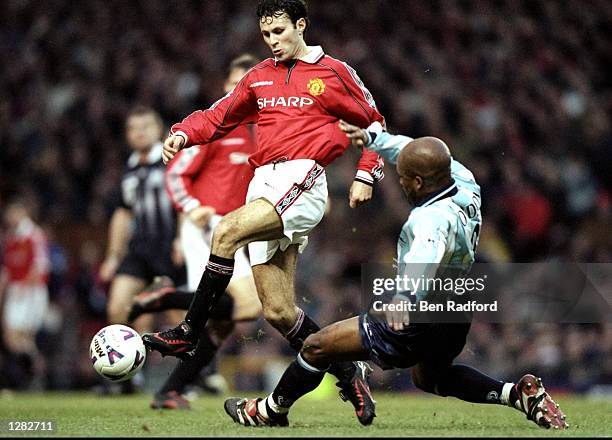 Ryan Giggs of Manchester United goes past Dean Gordon of Middlesbrough in the FA Carling Premiership match at Old Trafford in Manchester, England....