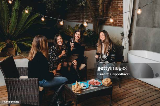 friends drinking red wine and talking together - friends social distancing stock pictures, royalty-free photos & images