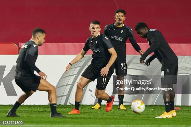 Christos Tzolis, Douglas Augusto Soares Gomez and Moussa Wague of PAOK FC during training session ahead of the UEFA Europa League Group E stage match...