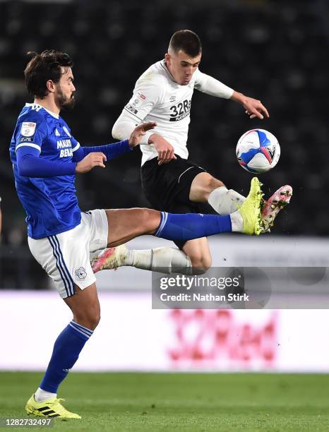 Jason Knight of Derby County and Marlon Pack of Cardiff City compete for the ball during the Sky Bet Championship match between Derby County and...