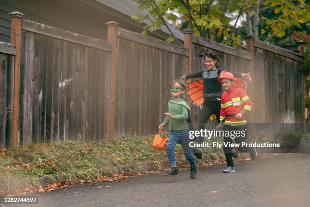 siblings trick or treating - halloween covid stock pictures, royalty-free photos & images