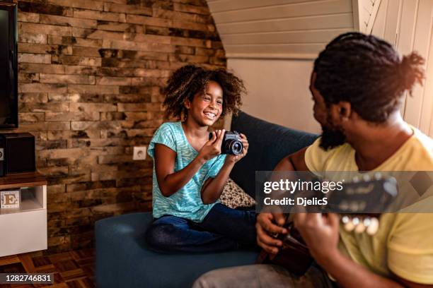 frustrated couple having bills to pay. - guitar isolated stock pictures, royalty-free photos & images